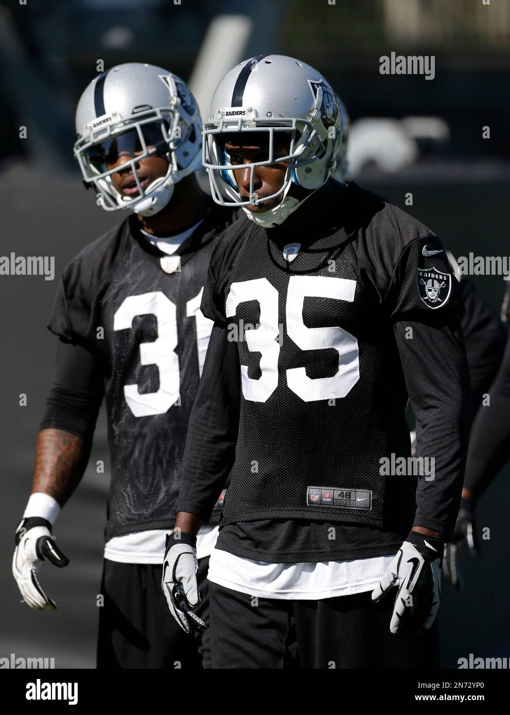 Oakland Raiders cornerbacks Tracy Porter, left, and Chimdi Chekwa