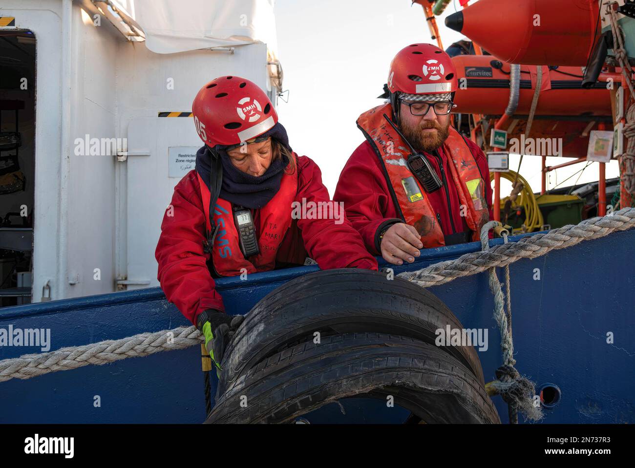 Vinaros, Spain. 10th Feb, 2023. 2 sailors remove the fenders of the rescue ship Aita Mari prior to sailing. The rescue ship Aita Mari of the NGO SMH left the port of Vinaros on the 10th February at 9:00 a.m. for the central Mediterranean to carry out its ninth mission. (Credit Image: © Ximena Borrazas/SOPA Images via ZUMA Press Wire) EDITORIAL USAGE ONLY! Not for Commercial USAGE! Stock Photo