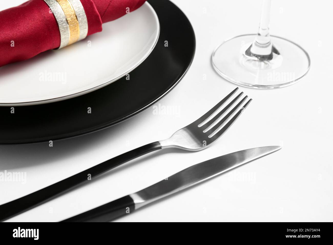 Elegant table setting on white background, closeup Stock Photo - Alamy