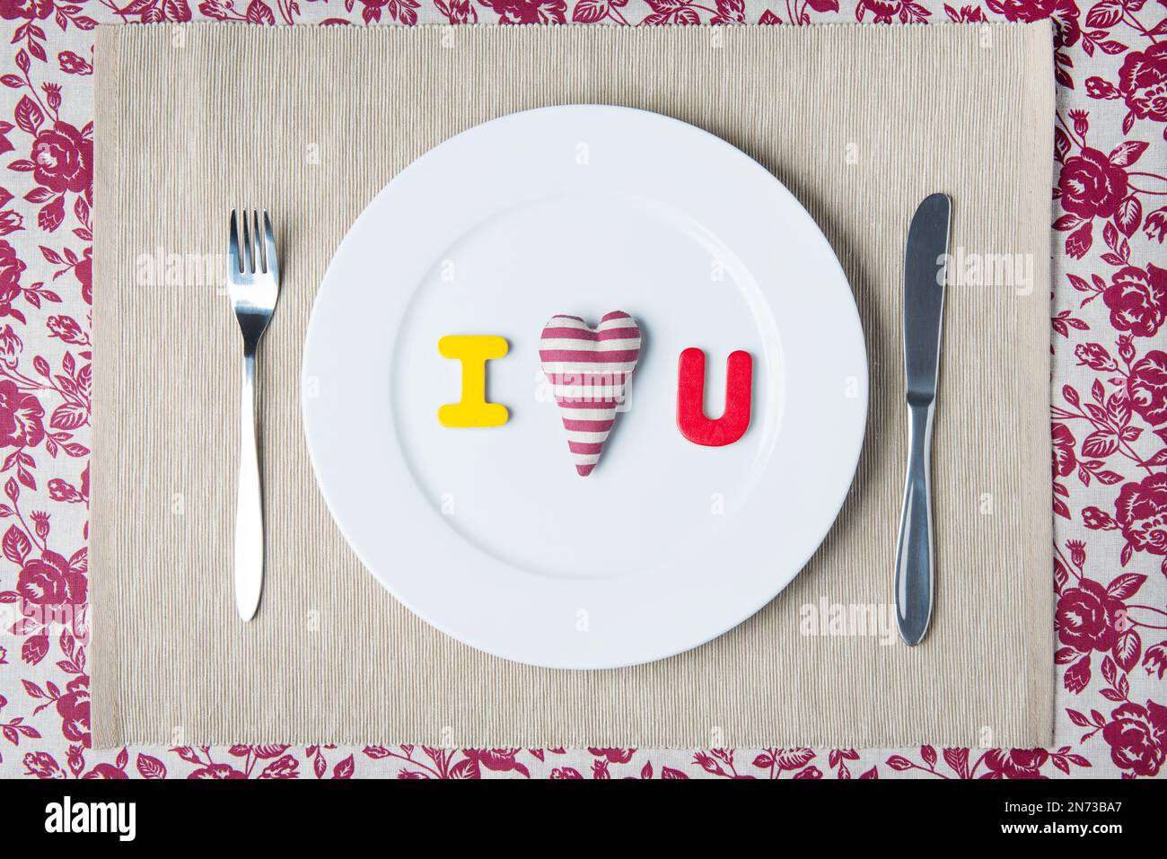 Valentine dinner concept - I LOVE YOU message on white plate Stock Photo
