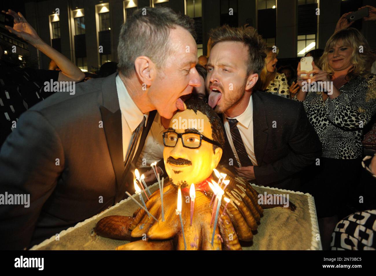 EXCLUSIVE - Actors Bryan Cranston, left, and Aaron Paul pose with a cake of  Vince Gilligan's face at AMC's and Sony Pictures Television's celebration  for the final episodes of 'Breaking Bad' on, image size:1300x955