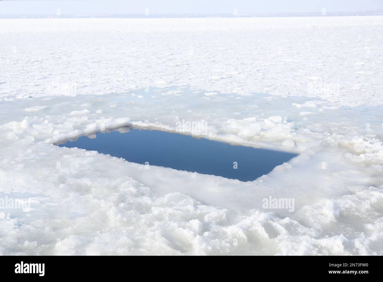 Ice hole in river on winter day. Baptism ritual Stock Photo Alamy