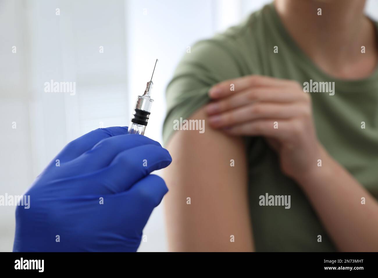 Immunization Injection Doctor giving injection to woman in hospital, closeup. Immunization ...