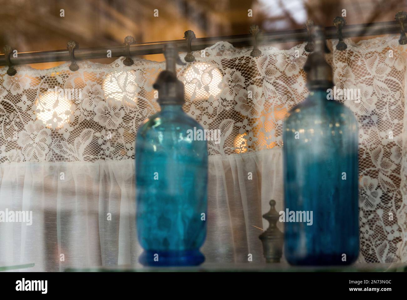 Window, France, antique bottles, lace curtain, glass Stock Photo