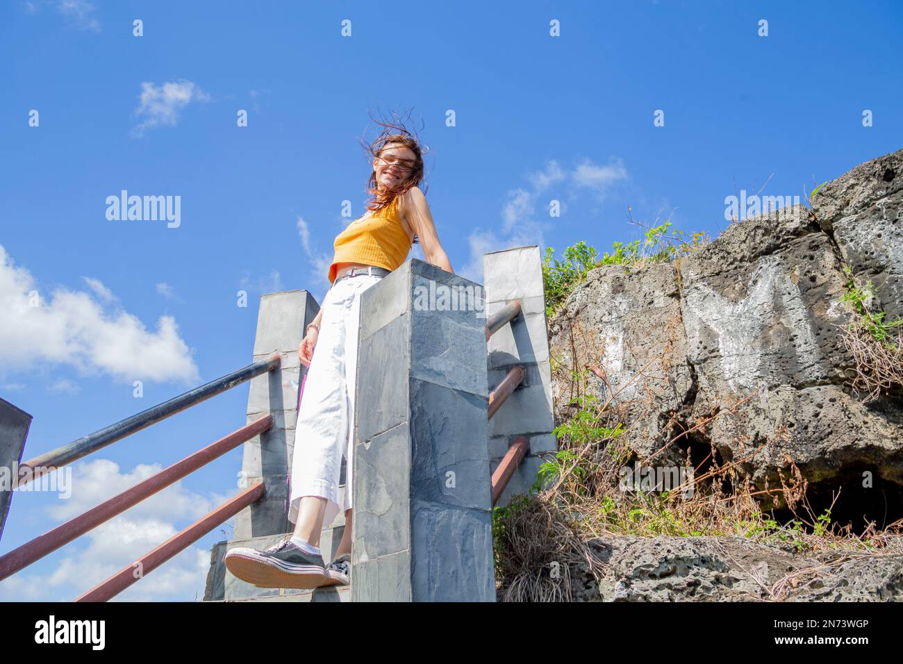 Young lady at Maconde view point. Famous road curve in the south of Mauritius island, Africa Stock Photo