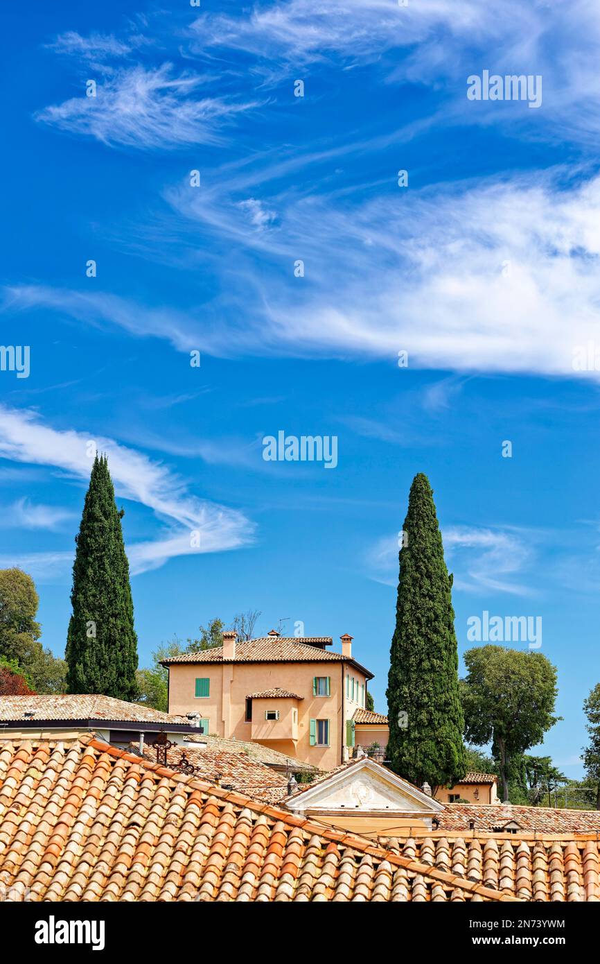 Houses in the northern Italian town of Asolo under a blue sky with clouds Stock Photo