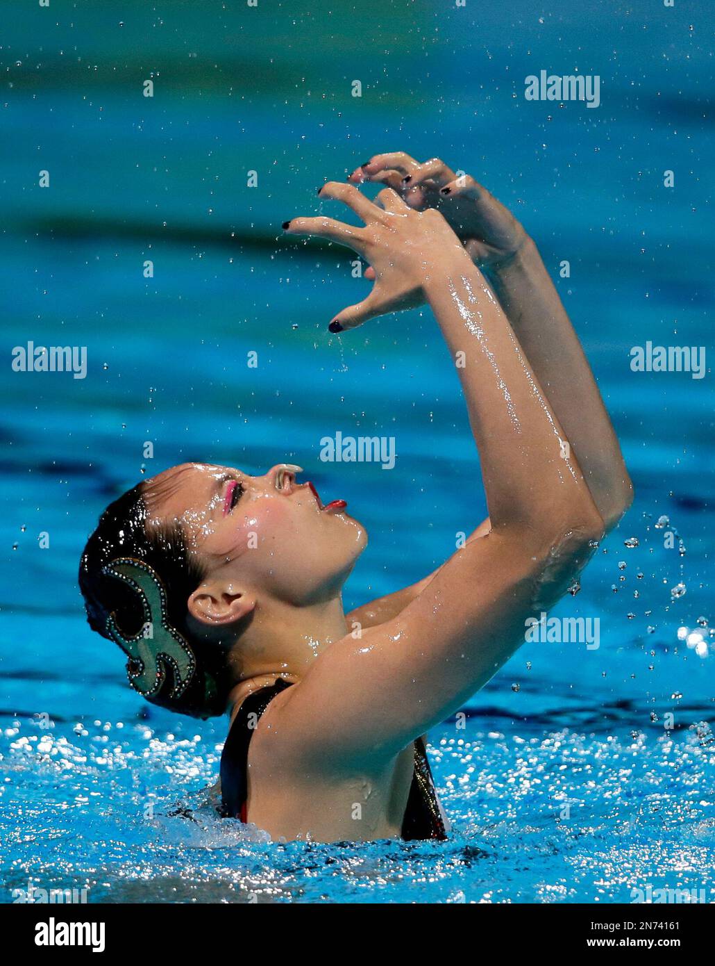 China's Huang Xuechen performs her routine in the synchronised swimming