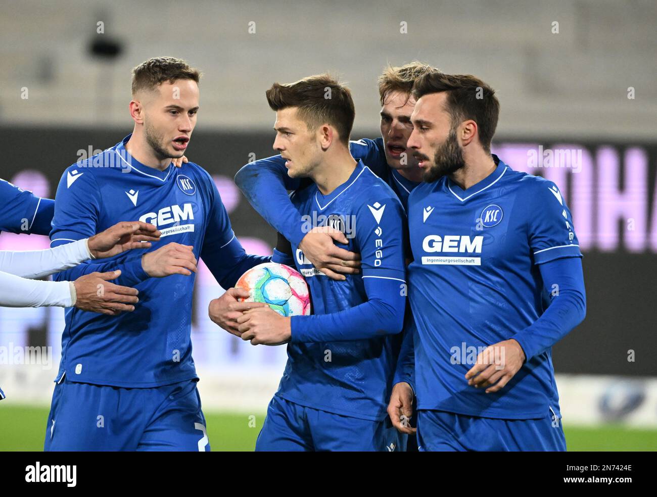 Karlsruhe, Germany. 10th Feb, 2023. Soccer: 2nd Bundesliga, Karlsruher SC - SpVgg Greuther Fürth, Matchday 20, at BBBank Wildpark. Karlsruhe's Marvin Wanitzek (M) celebrates his goal to make it 1:1 with Christoph Kobald (l-r), Mikkel Kaufmann and Fabian Schleusener. Credit: Uli Deck/dpa - IMPORTANT NOTE: In accordance with the requirements of the DFL Deutsche Fußball Liga and the DFB Deutscher Fußball-Bund, it is prohibited to use or have used photographs taken in the stadium and/or of the match in the form of sequence pictures and/or video-like photo series./dpa/Alamy Live News Stock Photo
