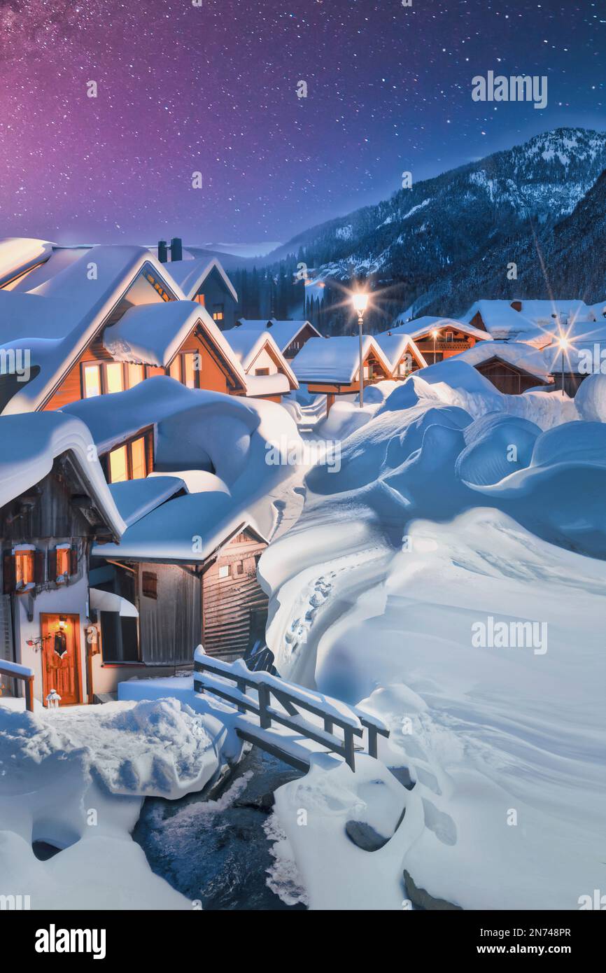 Fairytale village with wooden houses and snow covered roofs hi-res ...