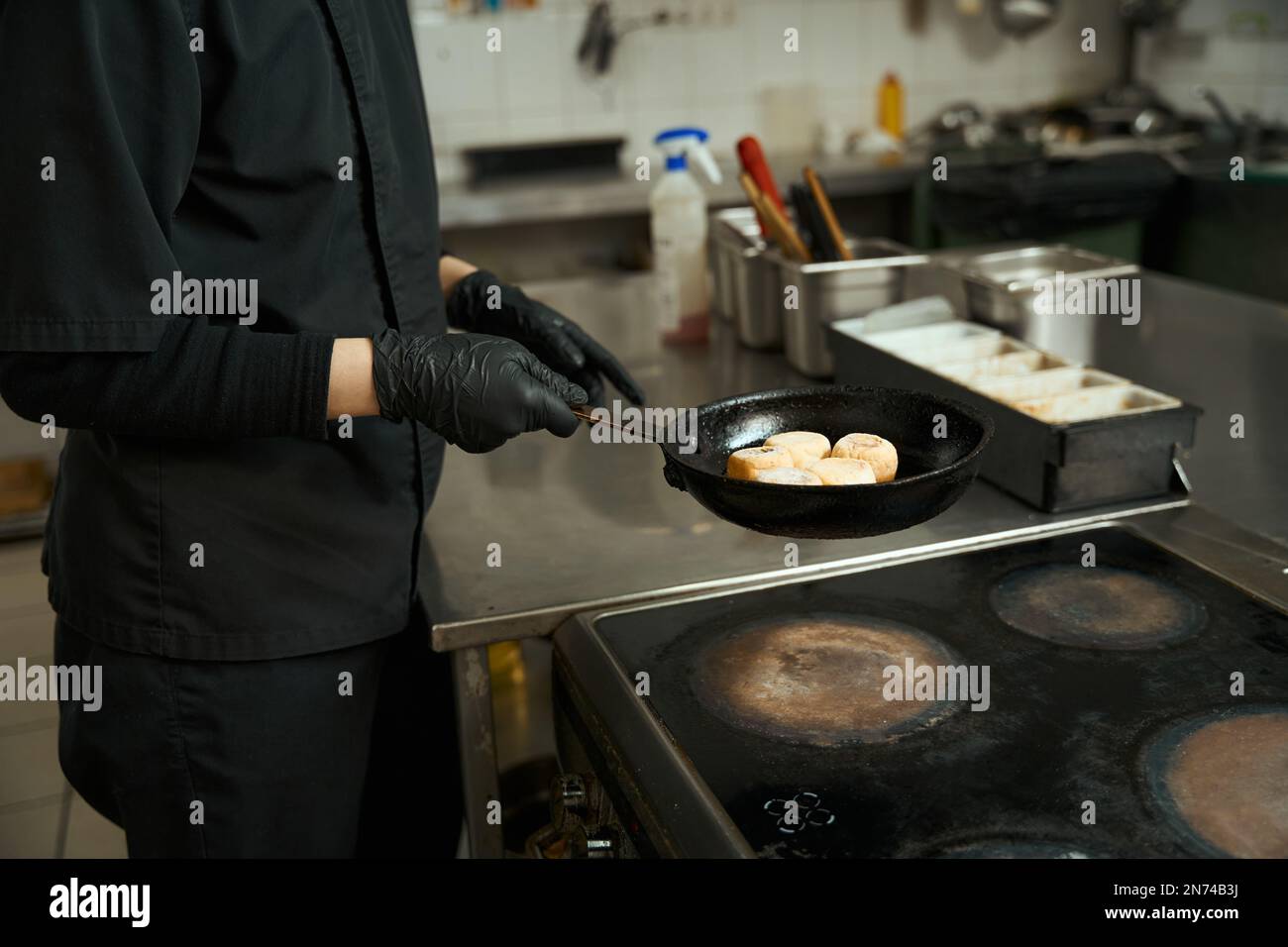 Chef fries in frying pan hi-res stock photography and images - Alamy