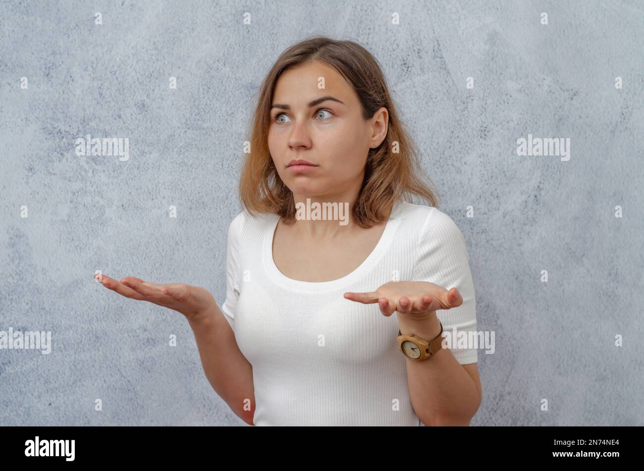 Young girl in an emotional state of misunderstanding, surprise Stock Photo