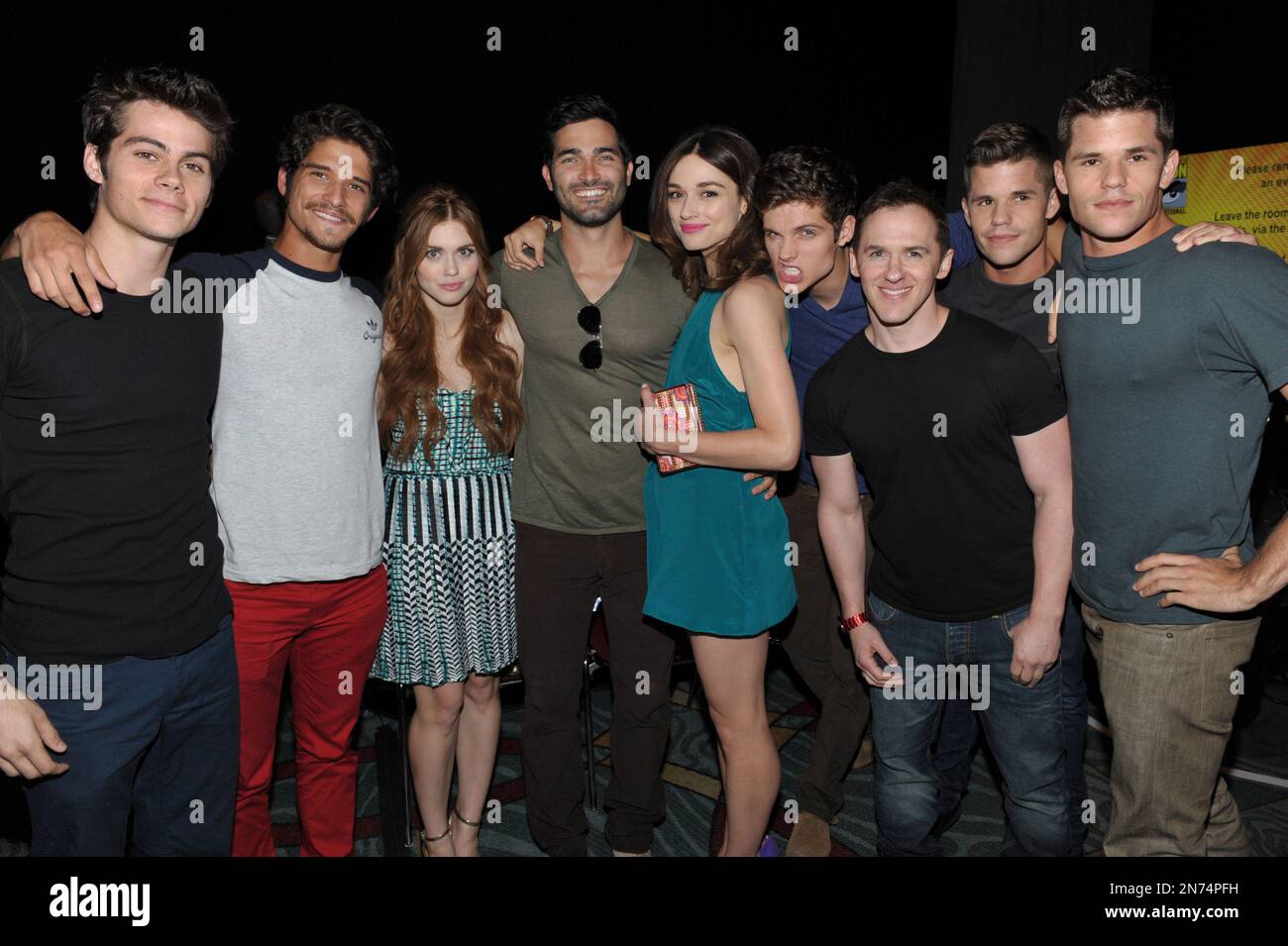 From left, actors Dylan O'Brien, Tyler Posey, Holland Roden, Tyler  Hoechlin, Crystal Reed, Daniel Sharman, writer Jeff Davis and actors  Charlie Carver and Max Carver pose backstage at the \, image size:1300x955