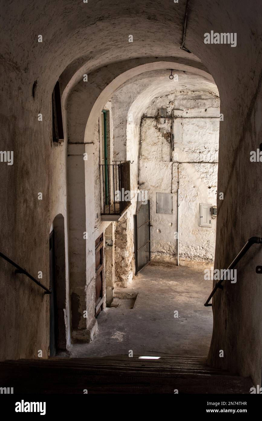 Enchanted empty alleyway in Monte Sant Angelo, Gargano peninsula in Italy Stock Photo