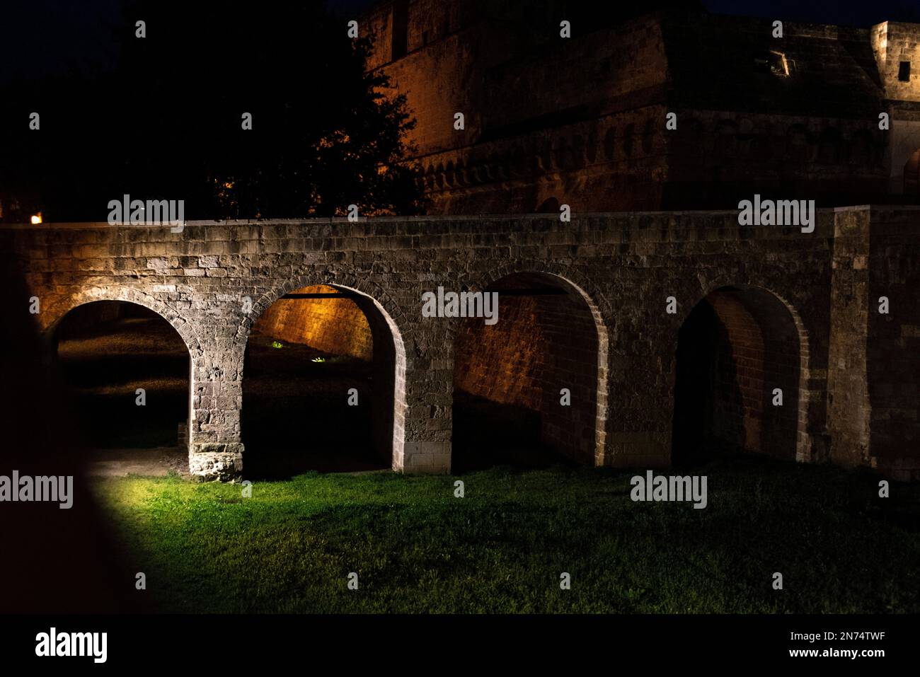 Medieval footbridge to castle Svevo di Bari at night, Southern Italy Stock Photo
