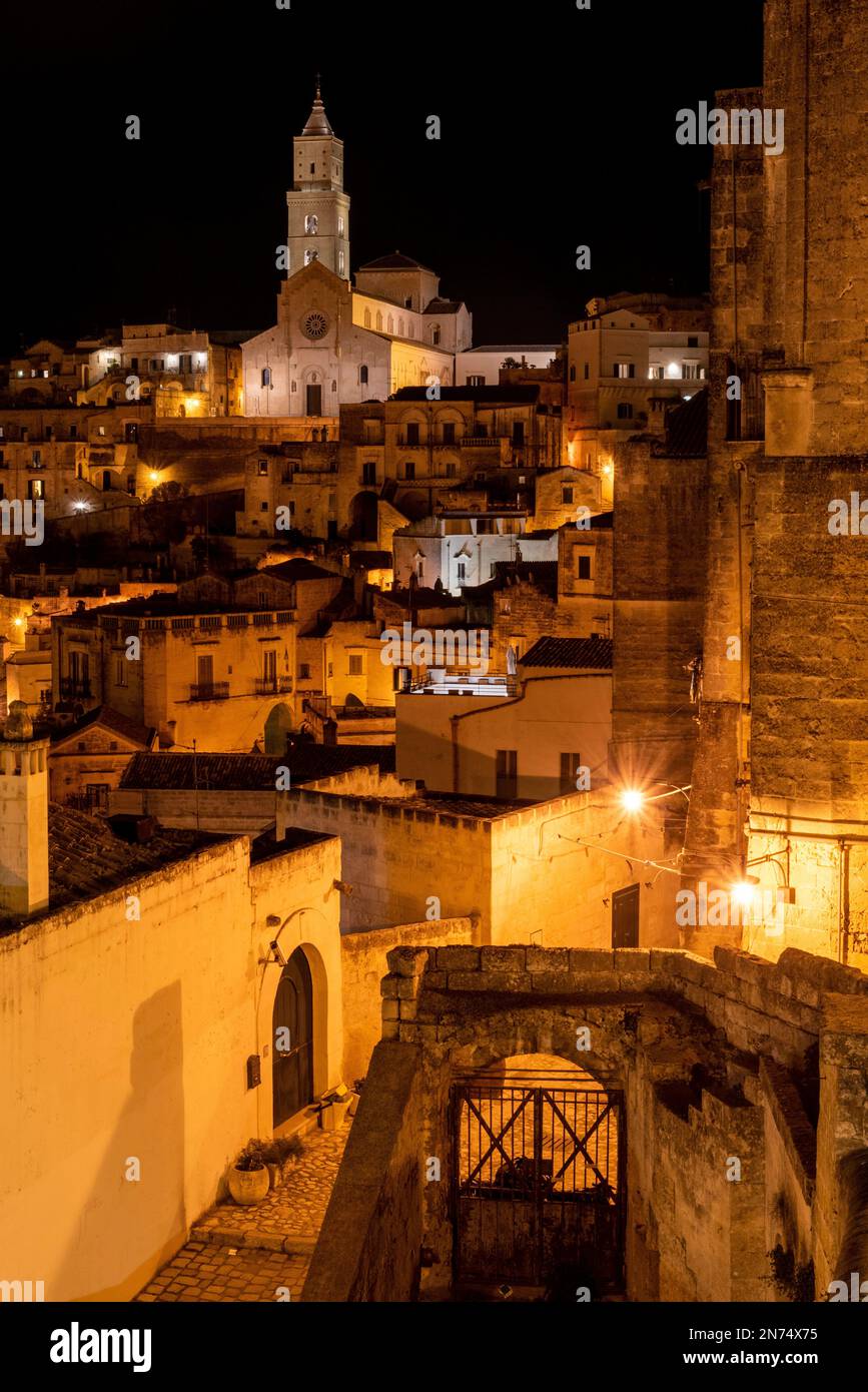 Scenic illuminated cathedral of Matera at night, Italy Stock Photo