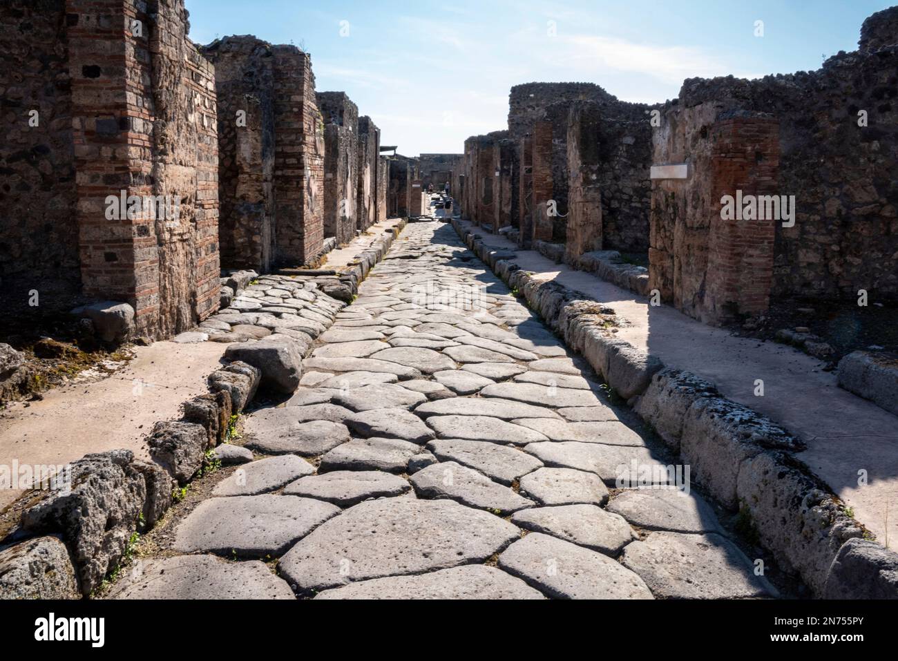 A beautiful typical cobbled street in the ancient city of Pompeii ...