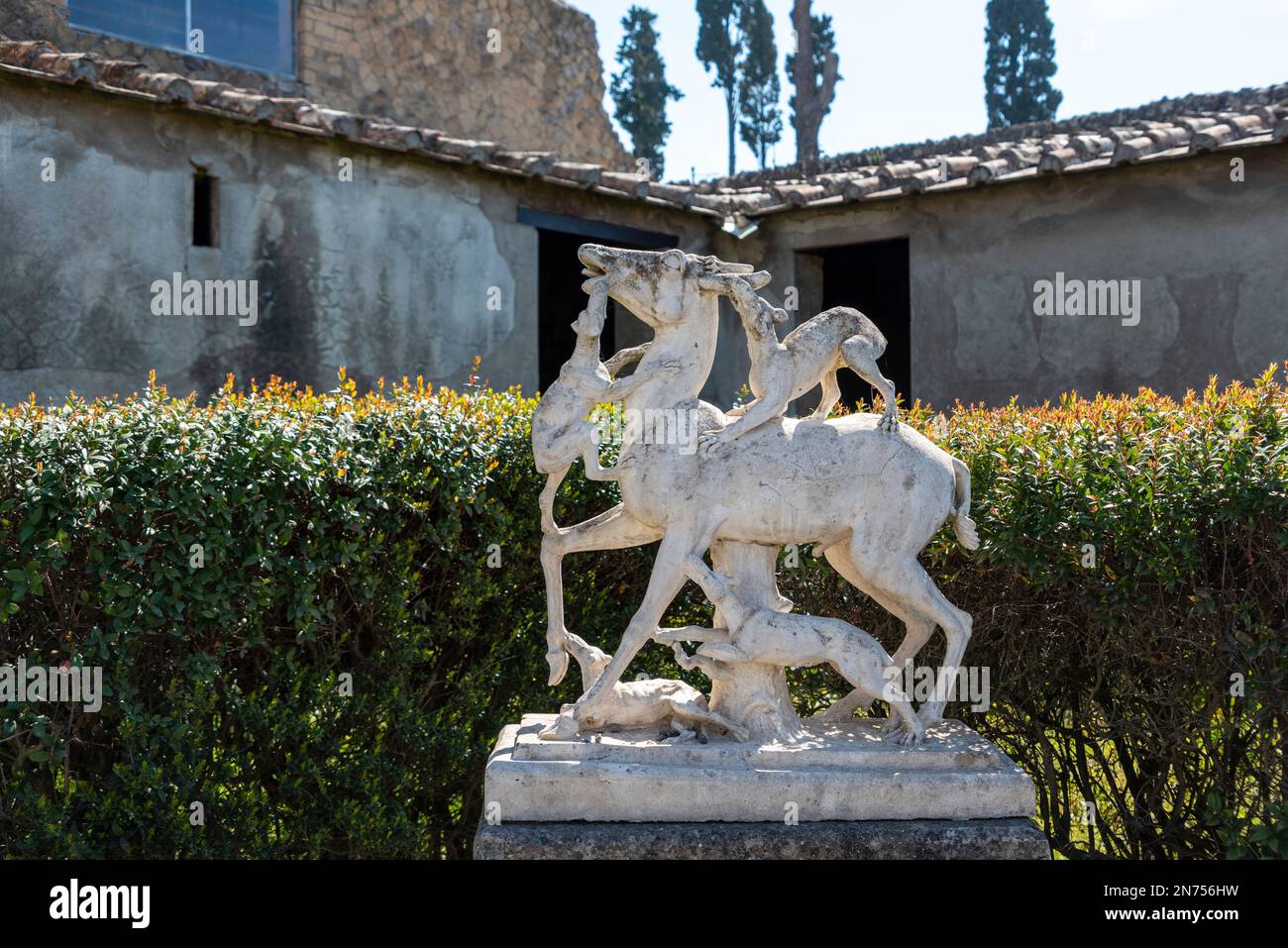 Ancient statues in a private garden of a typical Roman villa in