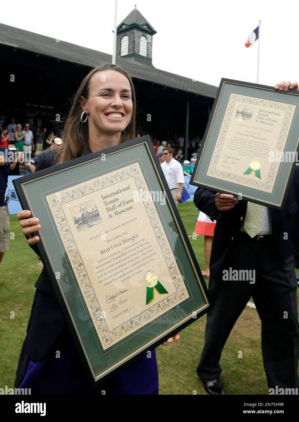 Tennis Great Martina Hingis Of Switzerland Smiles As She Walks With tennis-great-martina-hingis-of-switzerland-smiles-as-she-walks-with