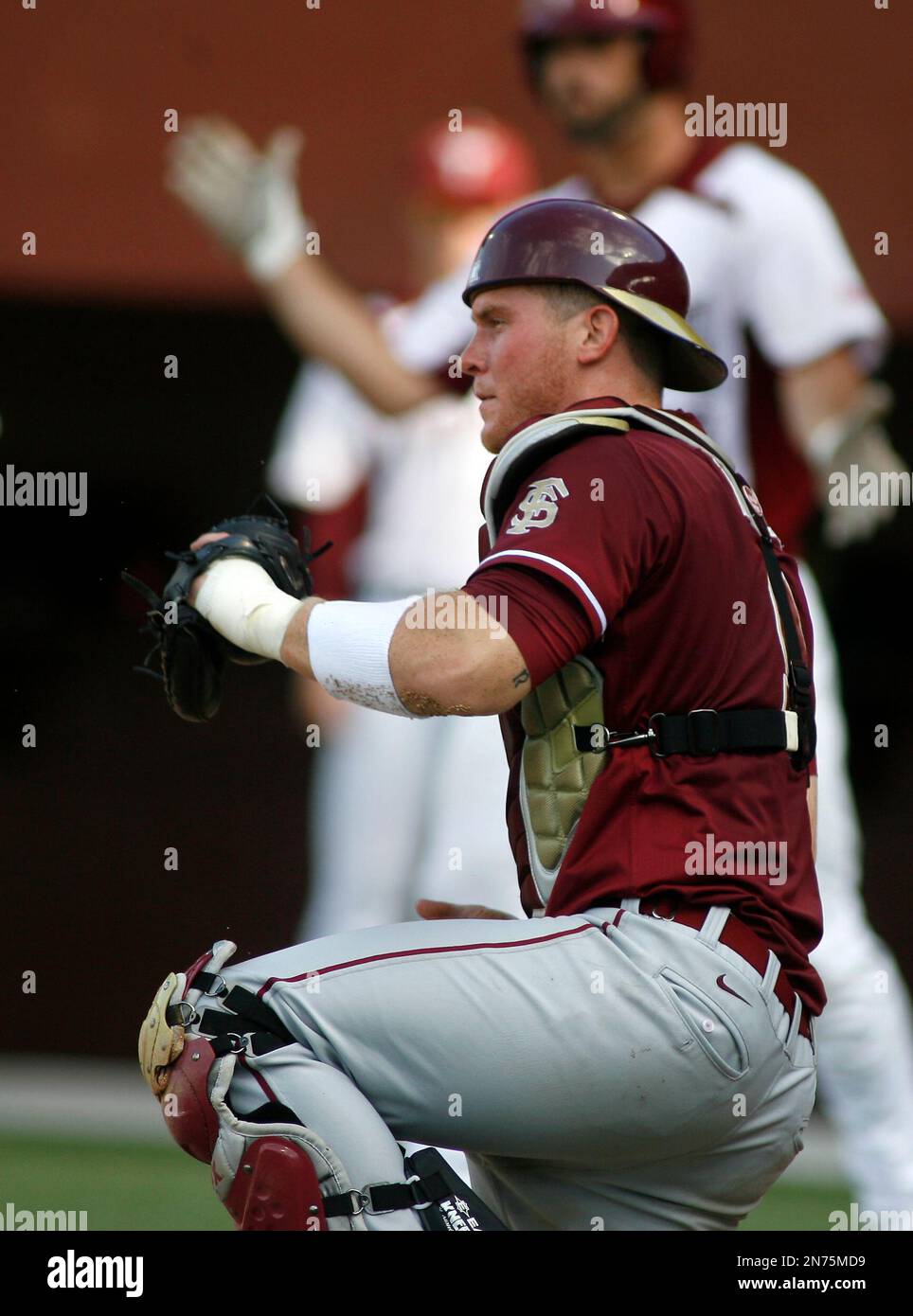 Florida State catcher Stephen McGee (9) in the fourth inning of an NCAA