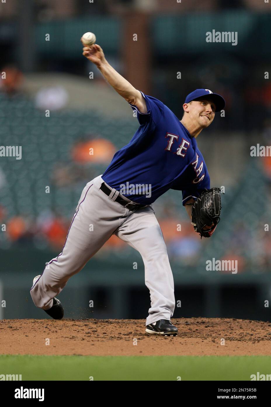 Texas Rangers starting pitcher Ross Wolf throws to the Baltimore ...