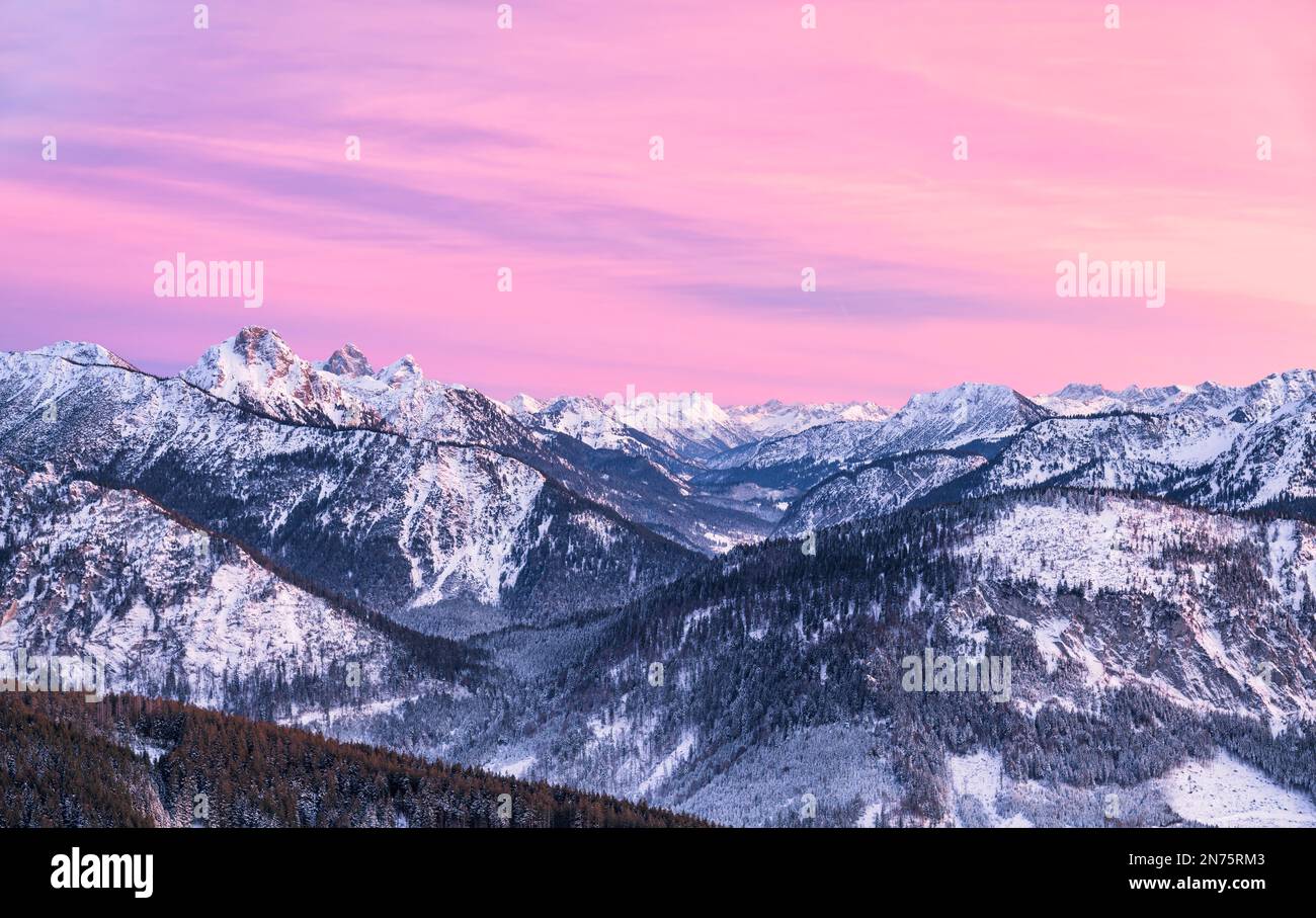Mountain landscape at dusk on cold winter day. View from Reuter Wanne to the Tannheimer mountains with Aggenstein, Gimpel and Rot Flüh on the left and Krinnenspitze on the right. Allgäu Alps, Bavaria, Tyrol, Germany, Austria Stock Photo