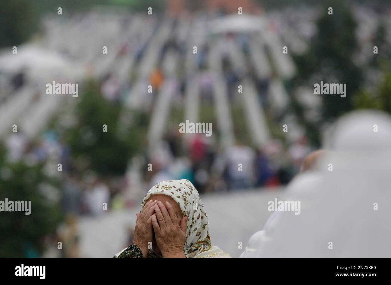 A Bosnian woman crie during a funeral ceremony at the memorial center