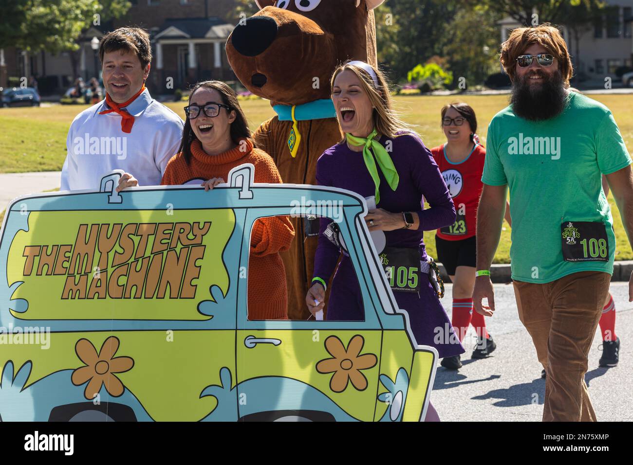 Suwanee, GA / USA - October 15, 2022:  Young people dress as the characters from the Scooby Doo cartoon, in the Spooky Spirits 5K on October 15, 2022. Stock Photo