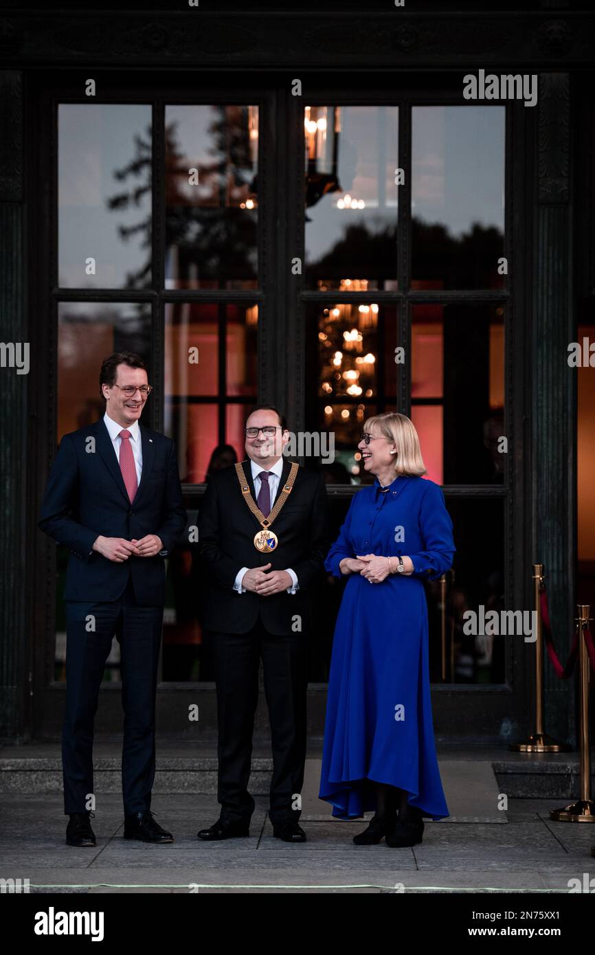 Essen, Germany. 10th Feb, 2023. Minister President of North Rhine-Westphalia Hendrik Wüst, Thomas Kufen, Mayor of the City of Essen, and Ursula Gather, Chairwoman of the Board of Trustees of the Krupp Foundation stand in front of the Villa. The celebration of the 150th 'Hügel anniversary' takes place at Villa Hügel in Essen. The highlight of the ceremony is the official opening of the transmedia real-time installation 'kontraste' by German President Steinmeier. Credit: Fabian Strauch/dpa/Alamy Live News Stock Photo