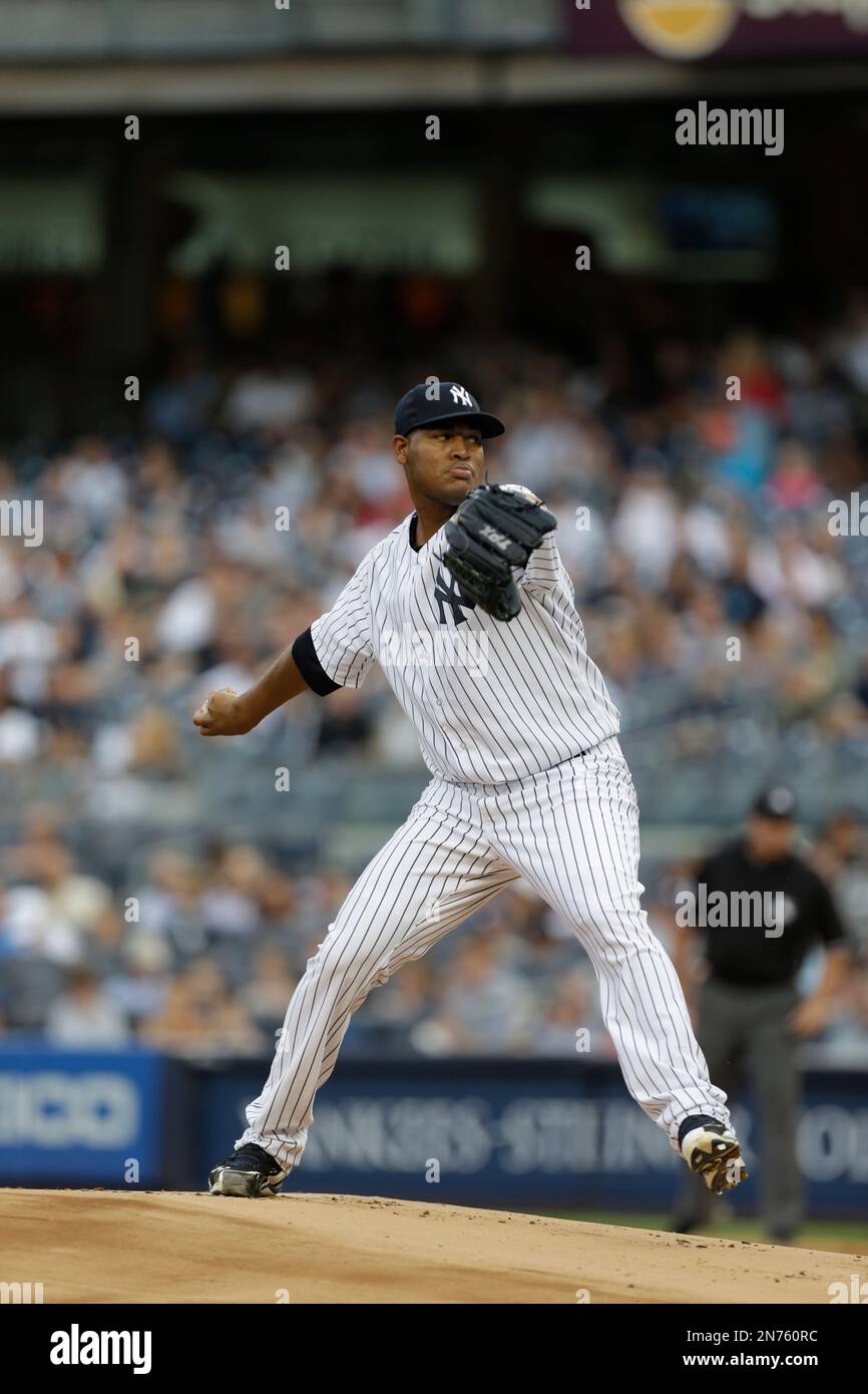New York Yankees starting pitcher Ivan Nova (47) winds up in a baseball