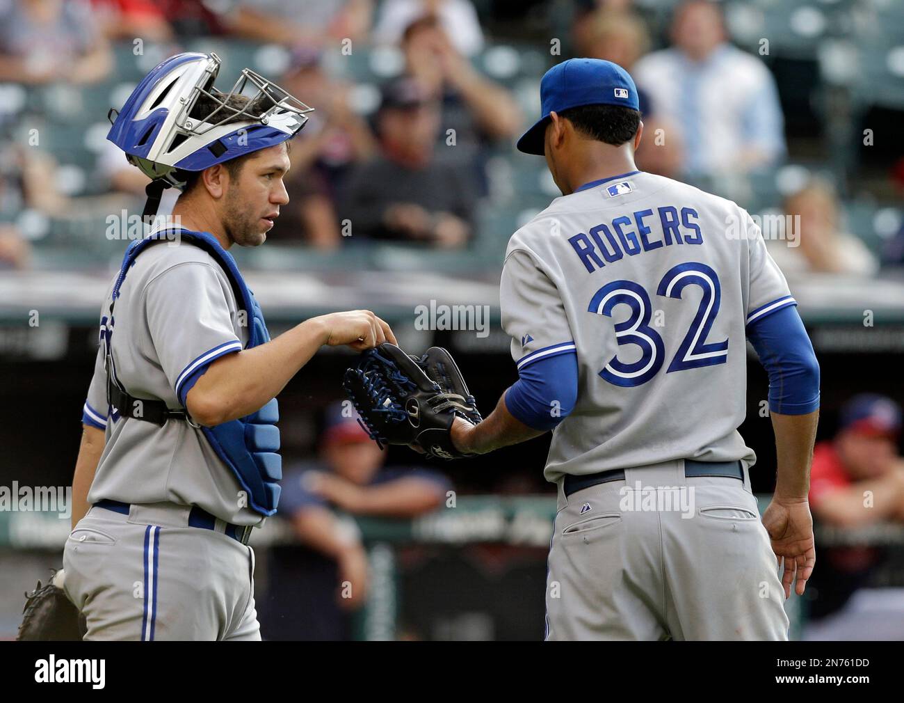 Toronto Blue Jays catcher Josh Thole, left, talks to relief pitcher 