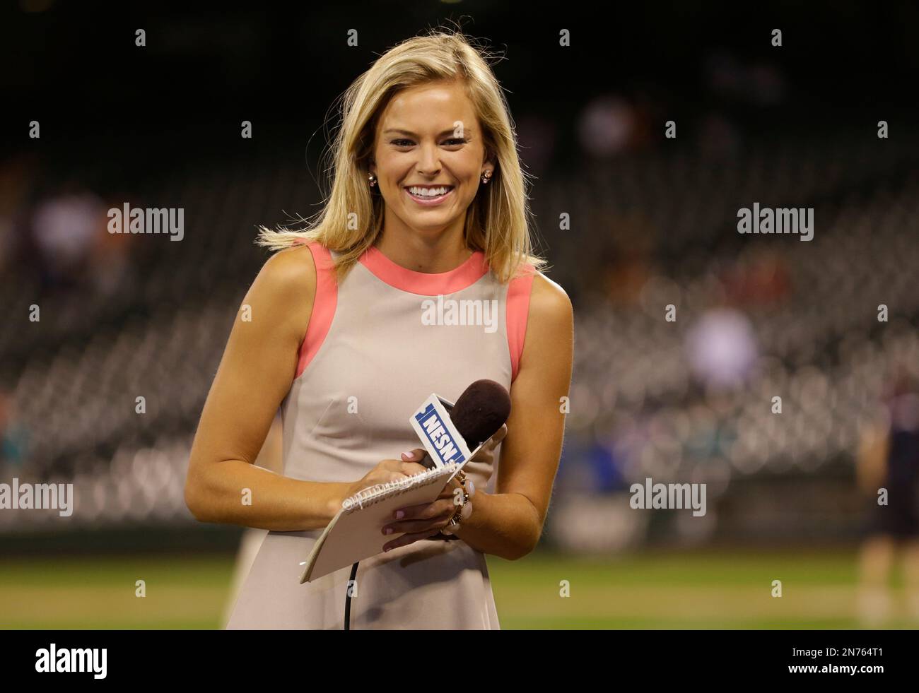 NESN Boston Red Sox reporter Jamie Erdahl waits to conduct an interview