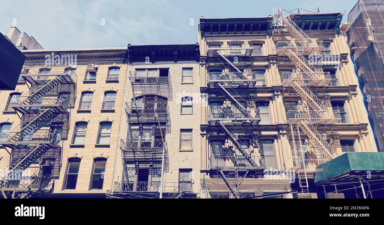 Color toned picture of buildings with fire escapes, New York City, USA. Stock Photo