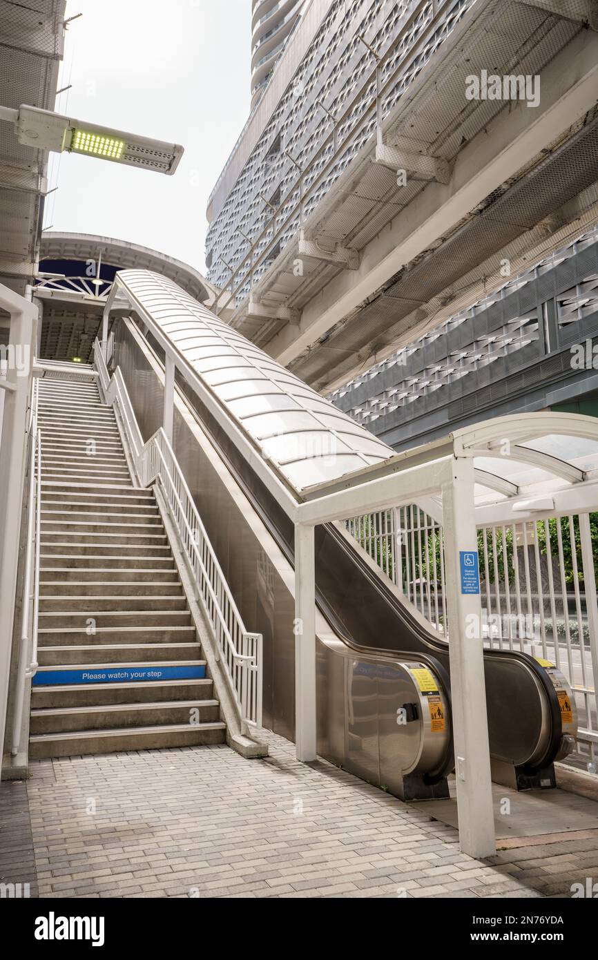 Stairs and escalator to enter the Miami Brickell Metrorail tram station ...