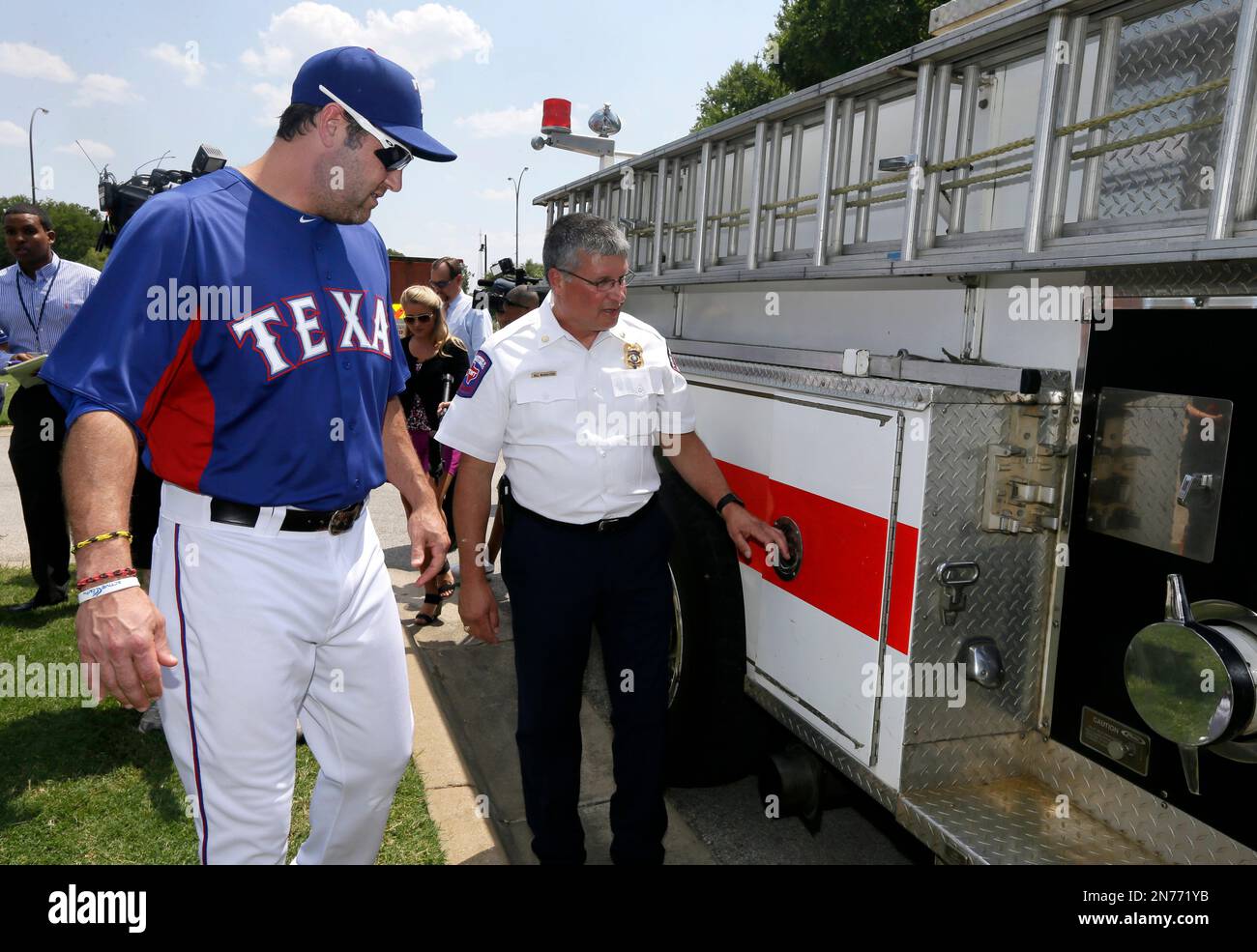 Texas Rangers' Lance Berkman, left, and Houston Astros' Brett Wallace visit  in a baseball game Sunday, March 31, 2013, in Houston. (AP Photo/Pat  Sullivan Stock Photo - Alamy