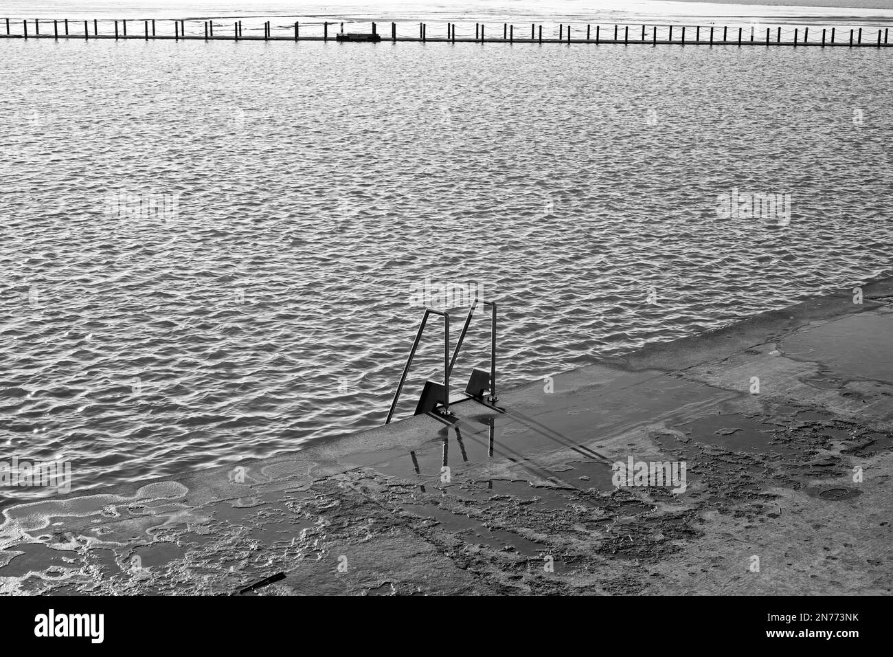 A ladder enabling swimmers to climb in and out of the Marine Lake in Weston-super-Mare, UK Stock Photo