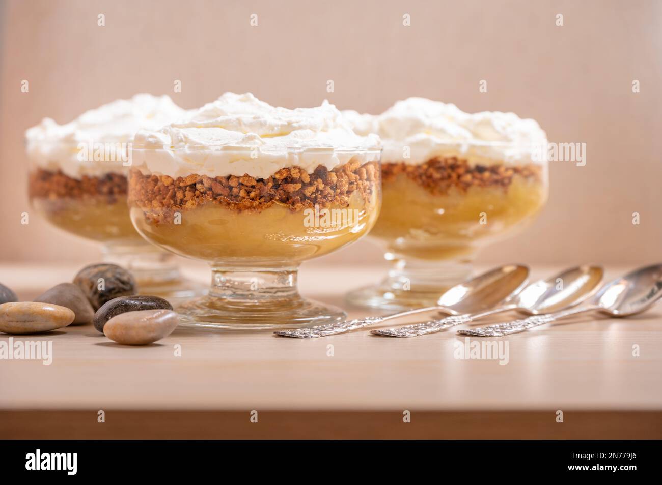A dessert table set with silver spoons Stock Photo Alamy