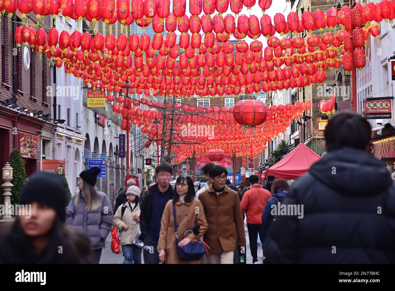 London, UK. 4 February 2023. Tourists sightseeing and chinese red
