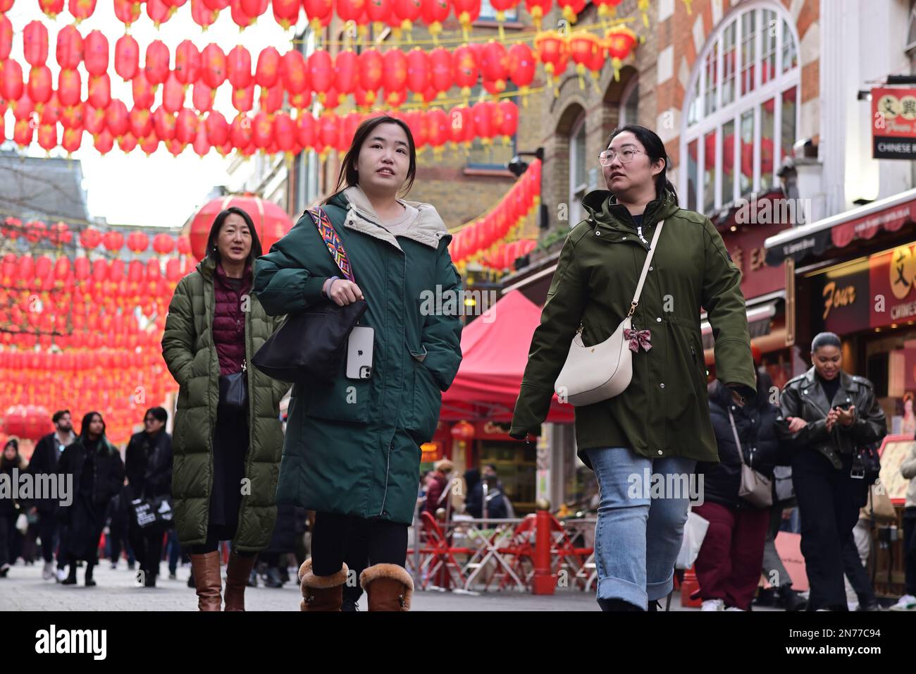 London, UK. 4 February 2023. Tourists sightseeing and chinese red lanterns in Chinatown, London
