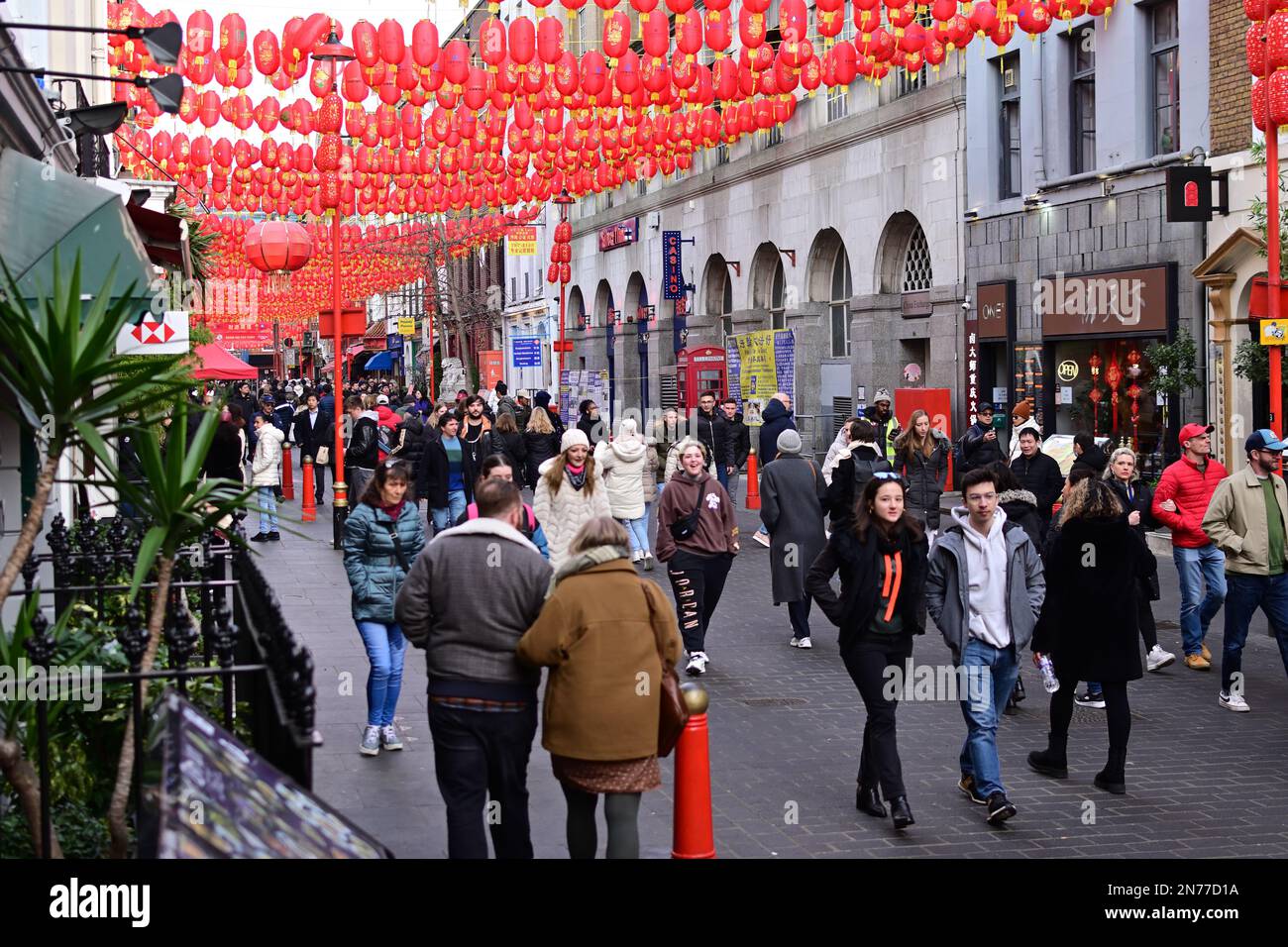 London, UK. 4 February 2023. Tourists sightseeing and chinese red lanterns in Chinatown, London