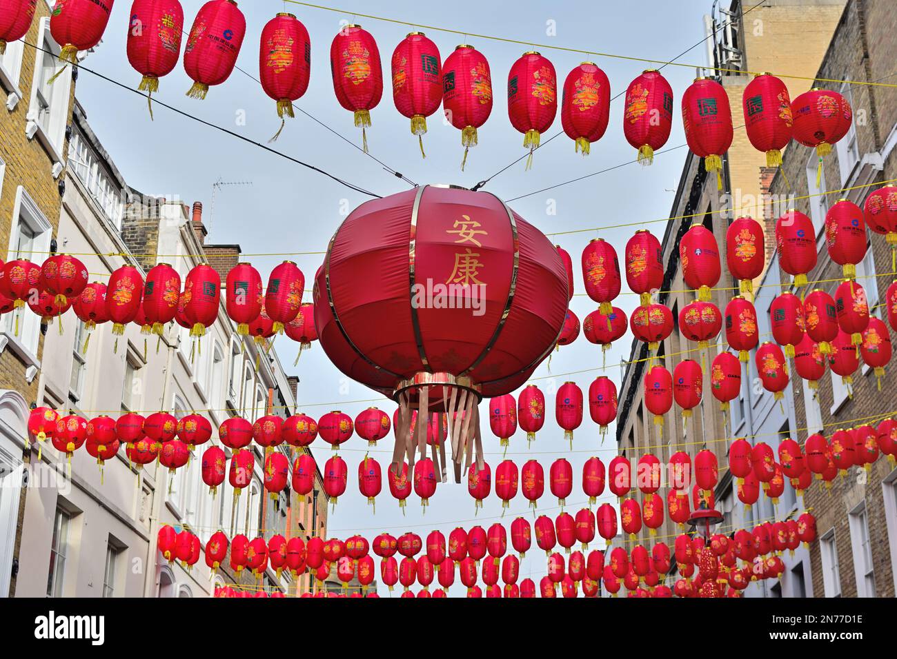 London, UK. 4 February 2023. Tourists sightseeing and chinese red lanterns in Chinatown, London