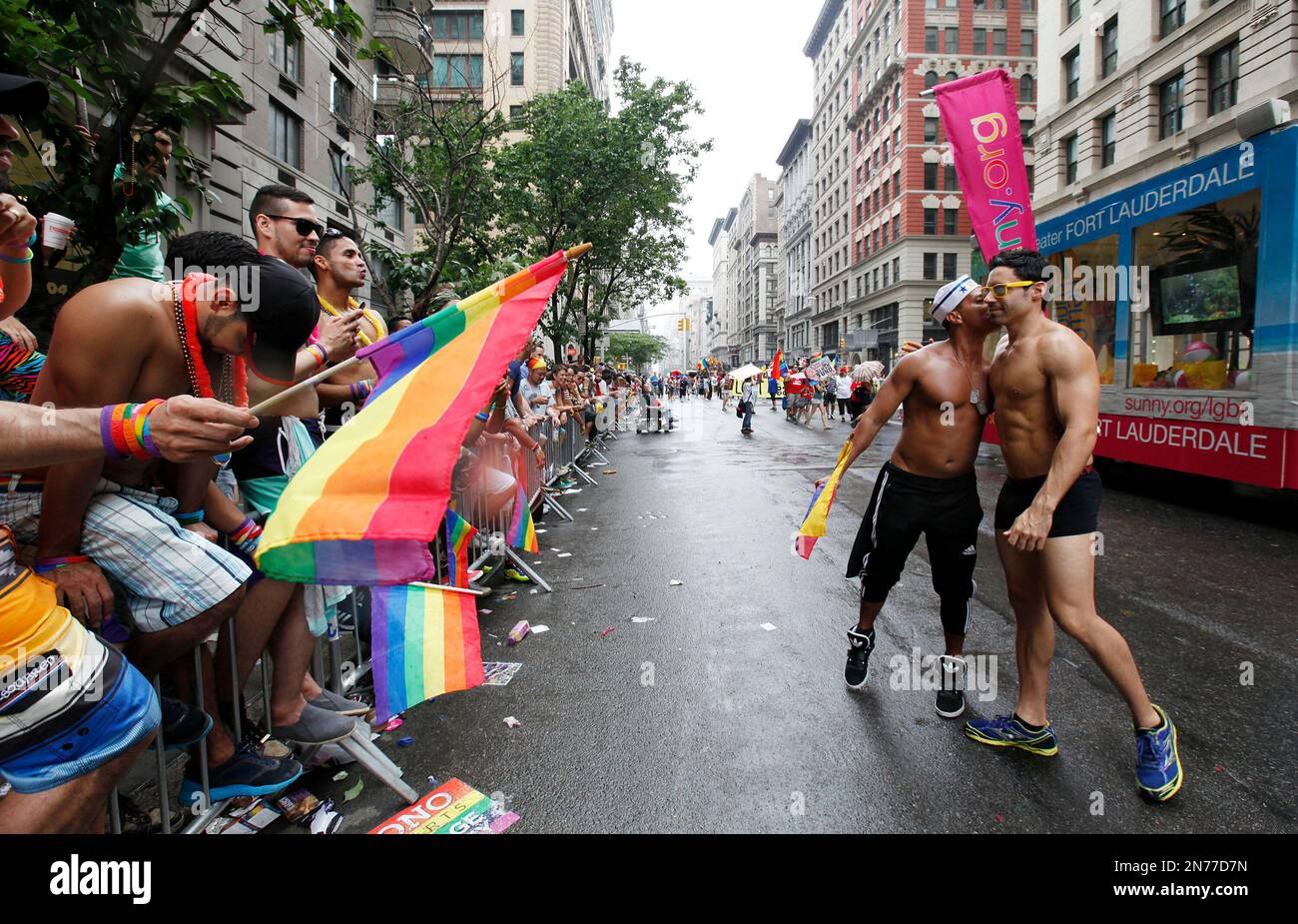 IMAGE DISTRIBUTED FOR GREATER FORT LAUDERDALE A parade onlooker jumps