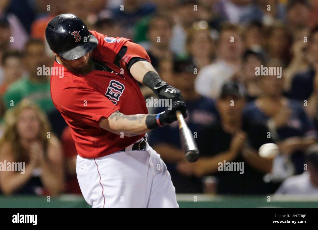 Boston Red Sox's Jonny Gomes (L) congratulates Mike Napoli after Napoli hit  a solo home run during the second inning of Game 5 of the American League  Championship Series against the Detroit