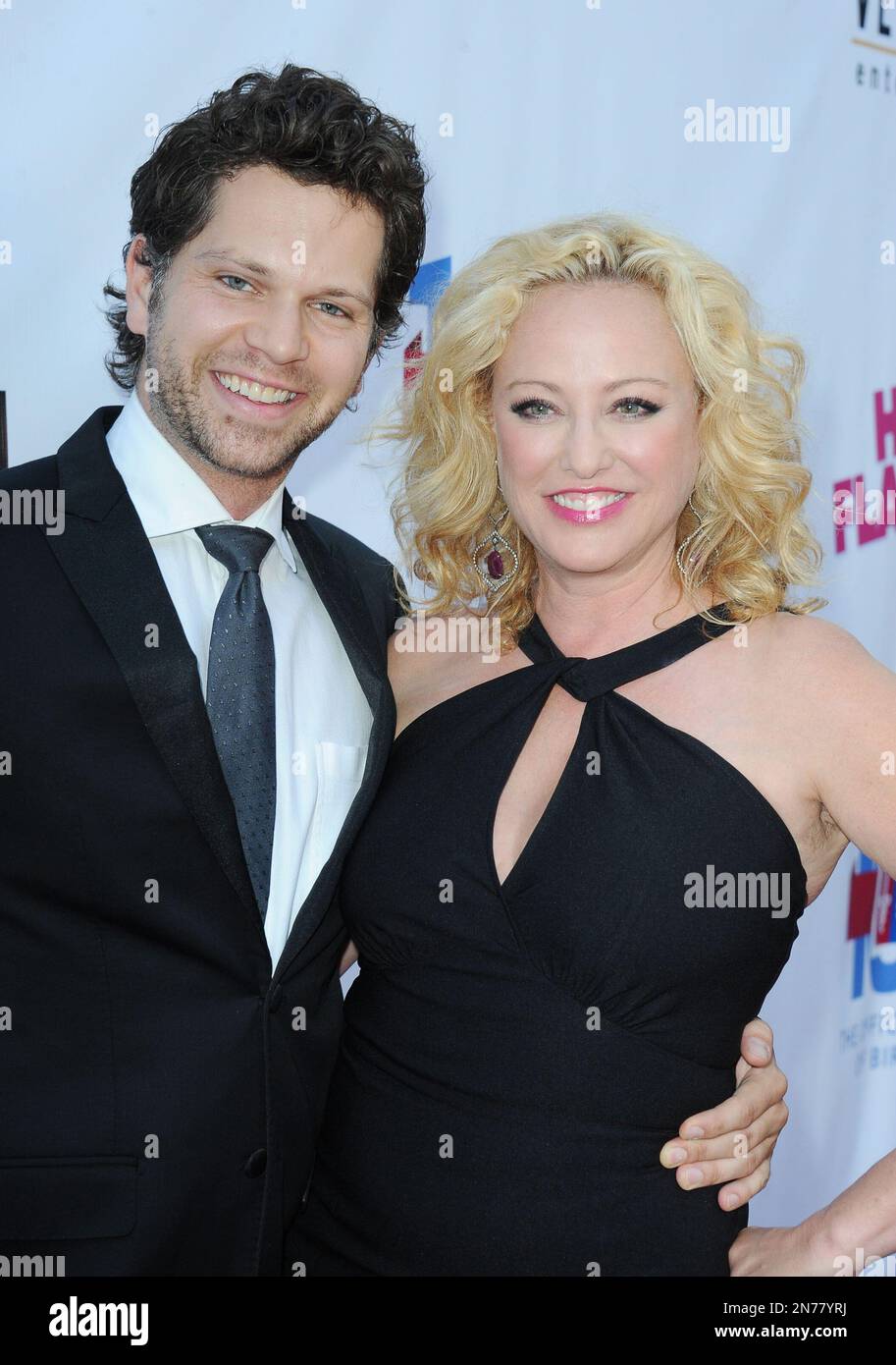 Virginia Madsen, at right, and Nick Holmes arrives at the LA premiere ...