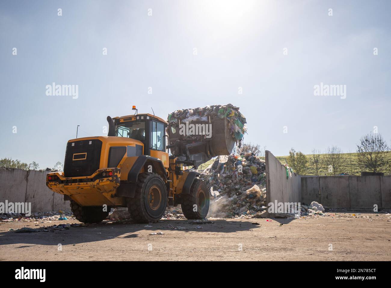 Heavy construction machine, front end loader moving along recycling