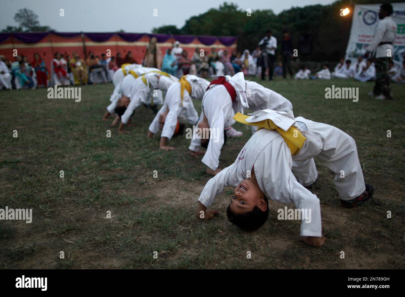 Pakistani Martial Arts students perform during an event to mark