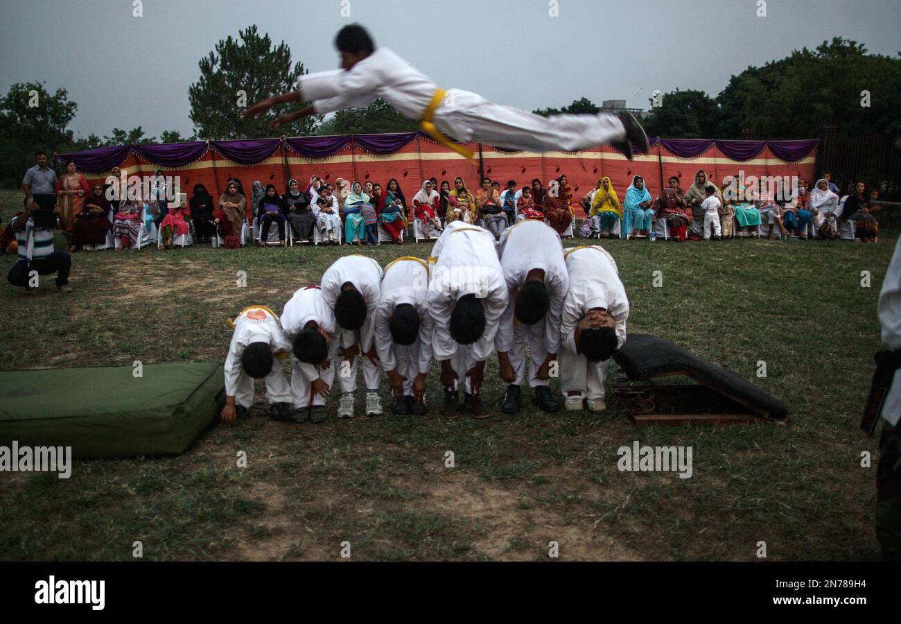 Pakistani Martial Arts students perform during an event to mark