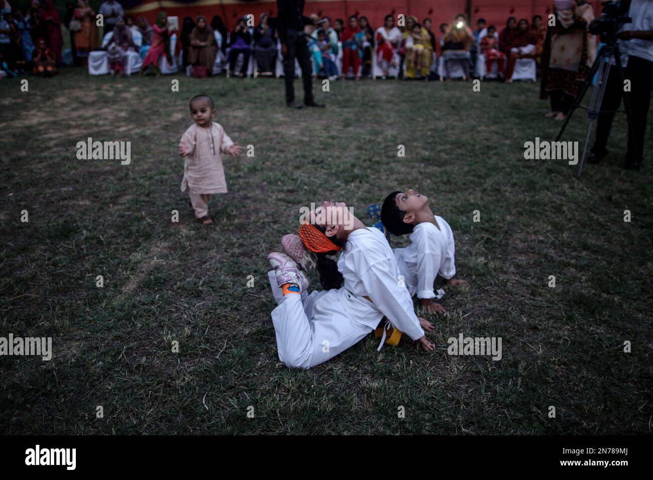 Pakistani Martial Arts students perform during an event to mark