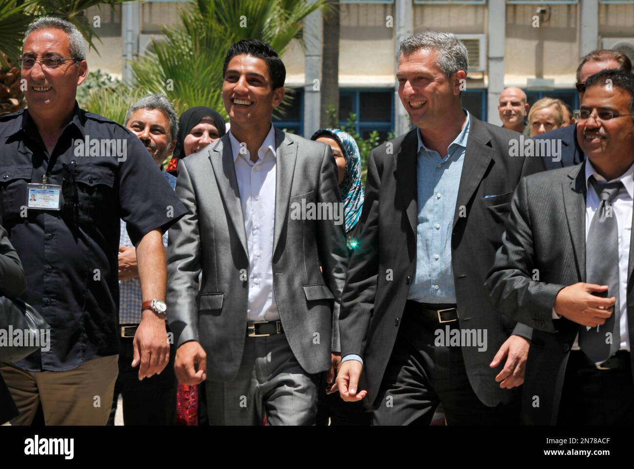 A Palestinian Arab Idol winner Mohammed Assaf, 2nd left, walks with ...