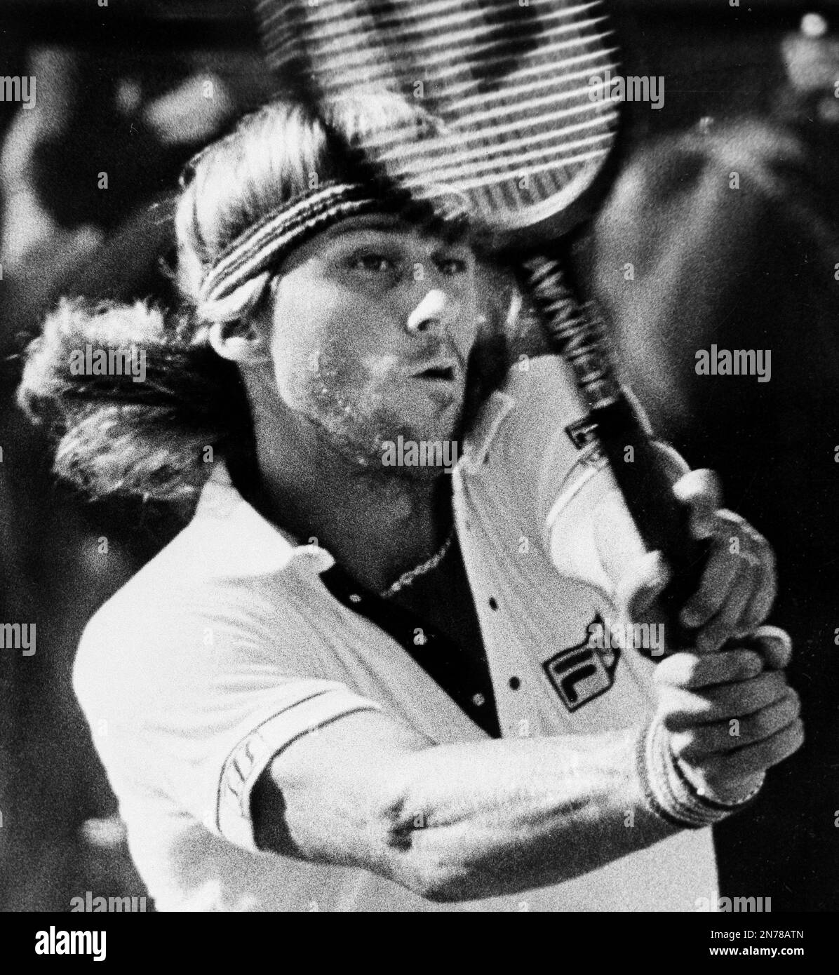 Top seeded Bjorn Borg of Sweden follows through on his backhand return ...