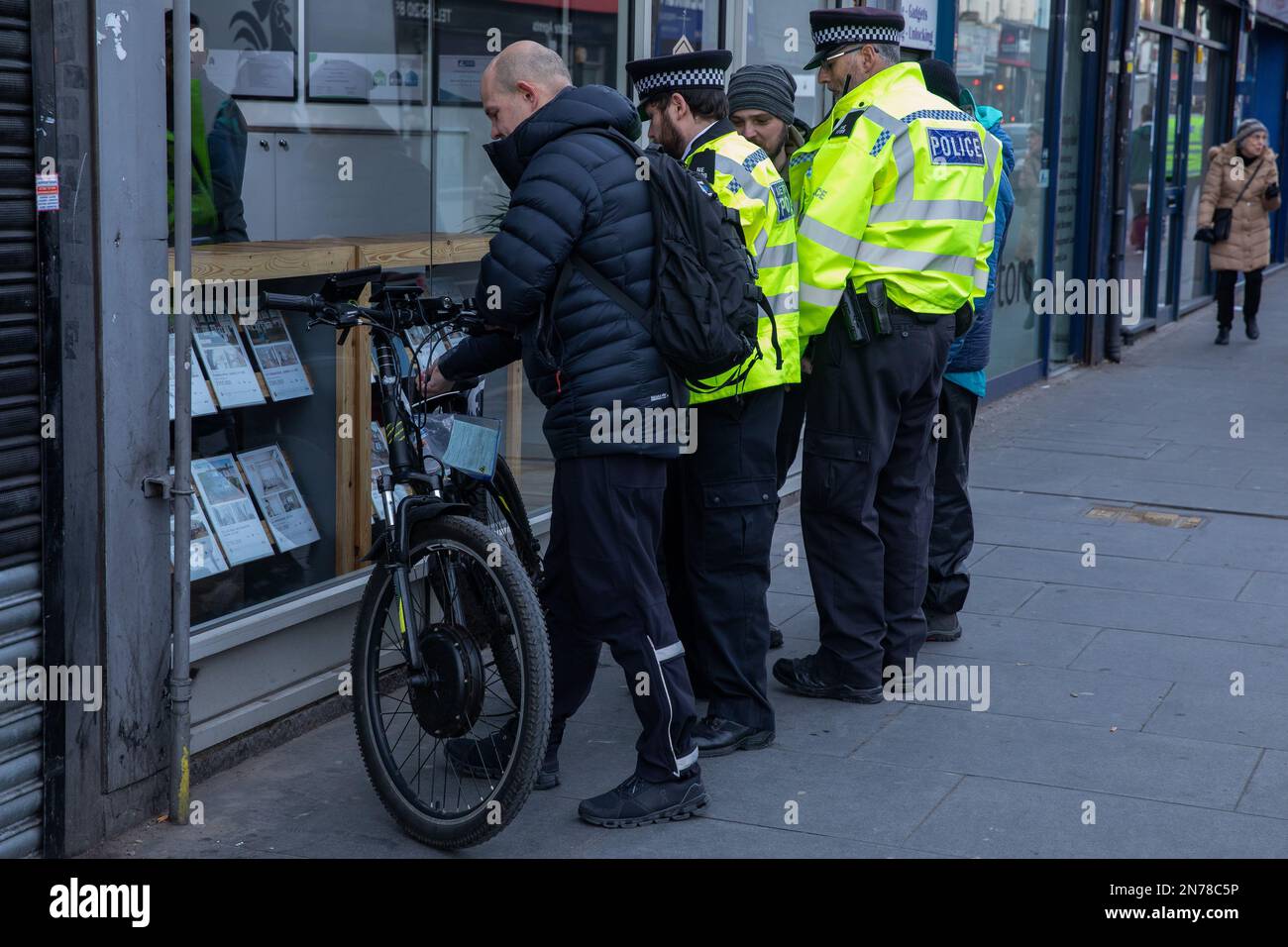 London, UK. 10th February, 2023. Metropolitan Police officers impound a bicycle during a pre-planned operation in Walthamstow to seize bicycles illegally modified to become mechanically propelled vehicles, mechanically propelled vehicles ridden without a licence or insurance and e-scooters. The Metropolitan Police officer in charge of the operation advised that complaints had been received of bicycles being ridden at high speeds in the local area. Credit: Mark Kerrison/Alamy Live News Stock Photo